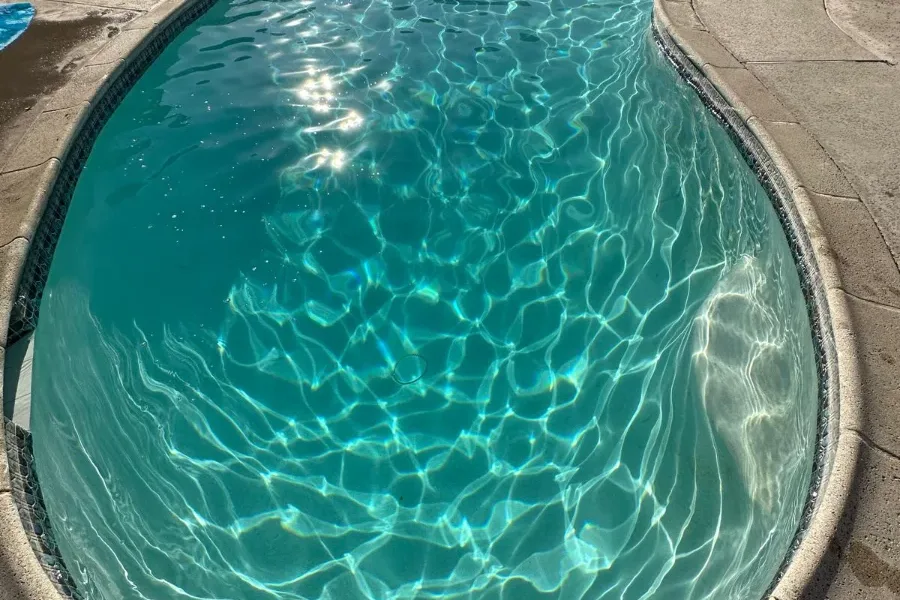 The same pool after service — clear water